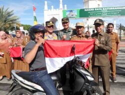 Sambut HUT ke-79 RI, Pj Wali Kota Banda Aceh dan Forkopimda Bagi Bendera Merah Putih