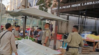 Satpol PP dan WH Aceh Besar Tertibkan PKL di Pasar Induk Lambaro